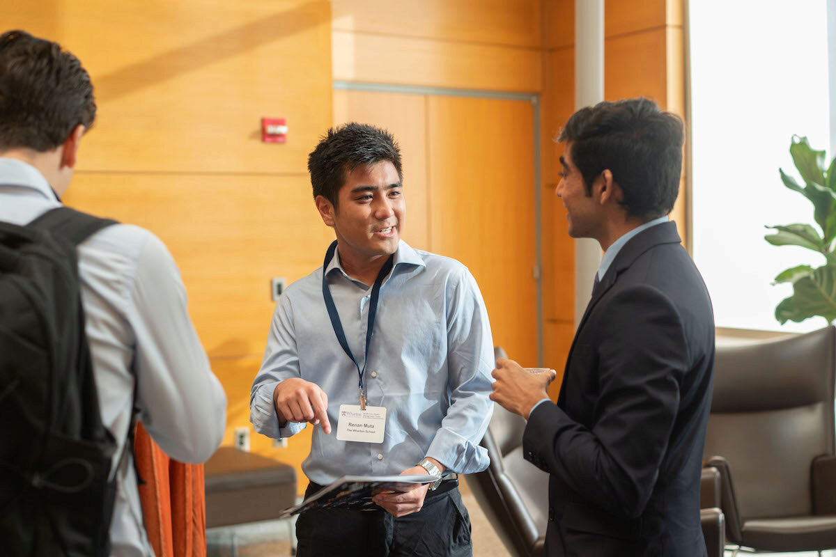 Frontiers in Quantitative Finance Conference participants in conversation