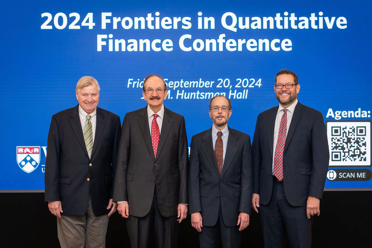 Craig MacKinlay, Bruce Jacobs, Ken Levy, and Chris Geczy gather for a photo at the 2024 Frontiers in Quantitative Finance Conference.