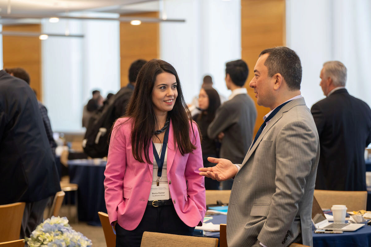 Conference attendees in conversation