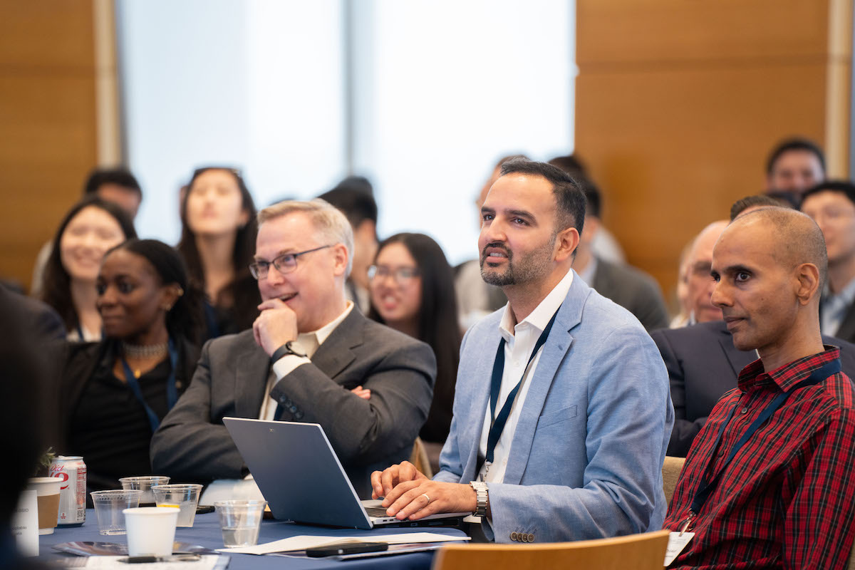 An audience watches the Frontiers in Quantitative Finance Conference.