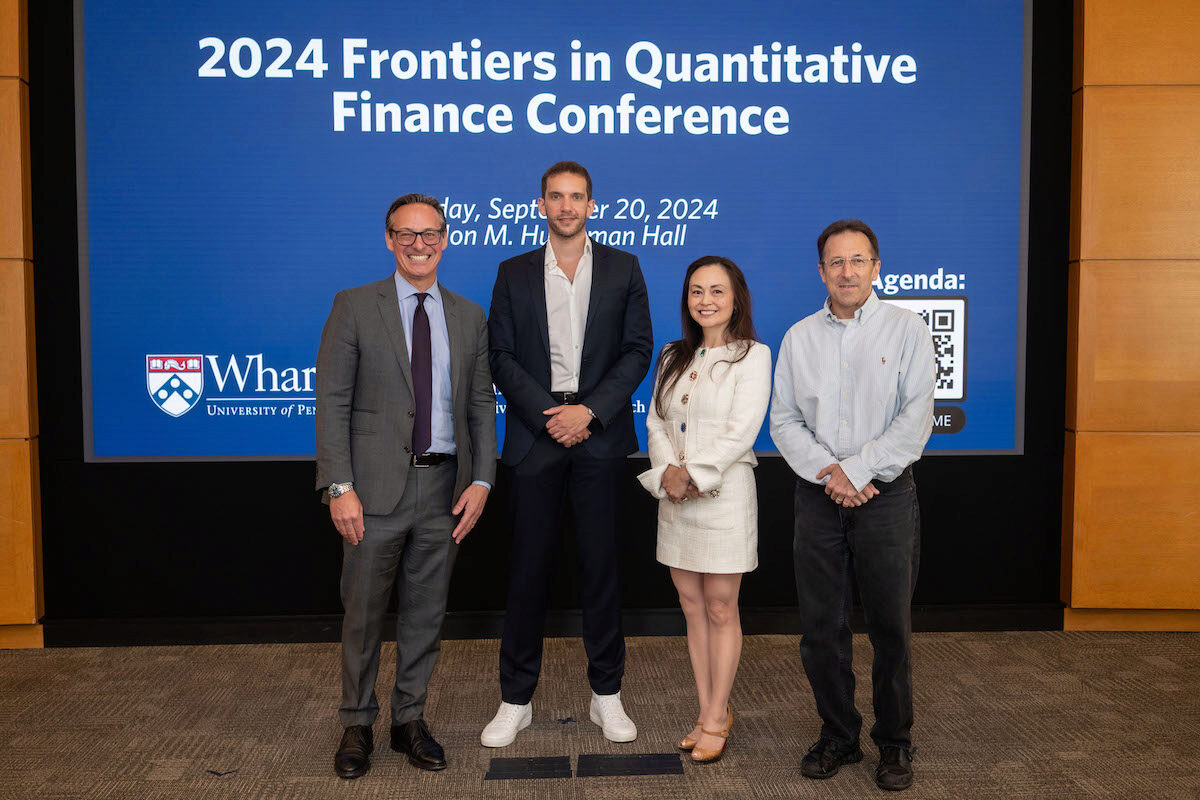 The panel poses for a photo at the Frontiers in Quantitative Finance Conference