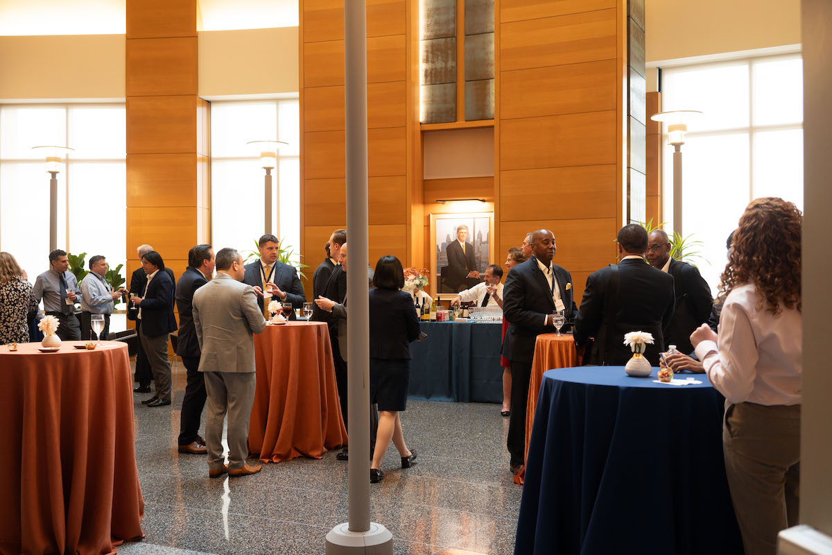 The reception following the Frontiers in Quantitative Finance Conference, with people mingling.