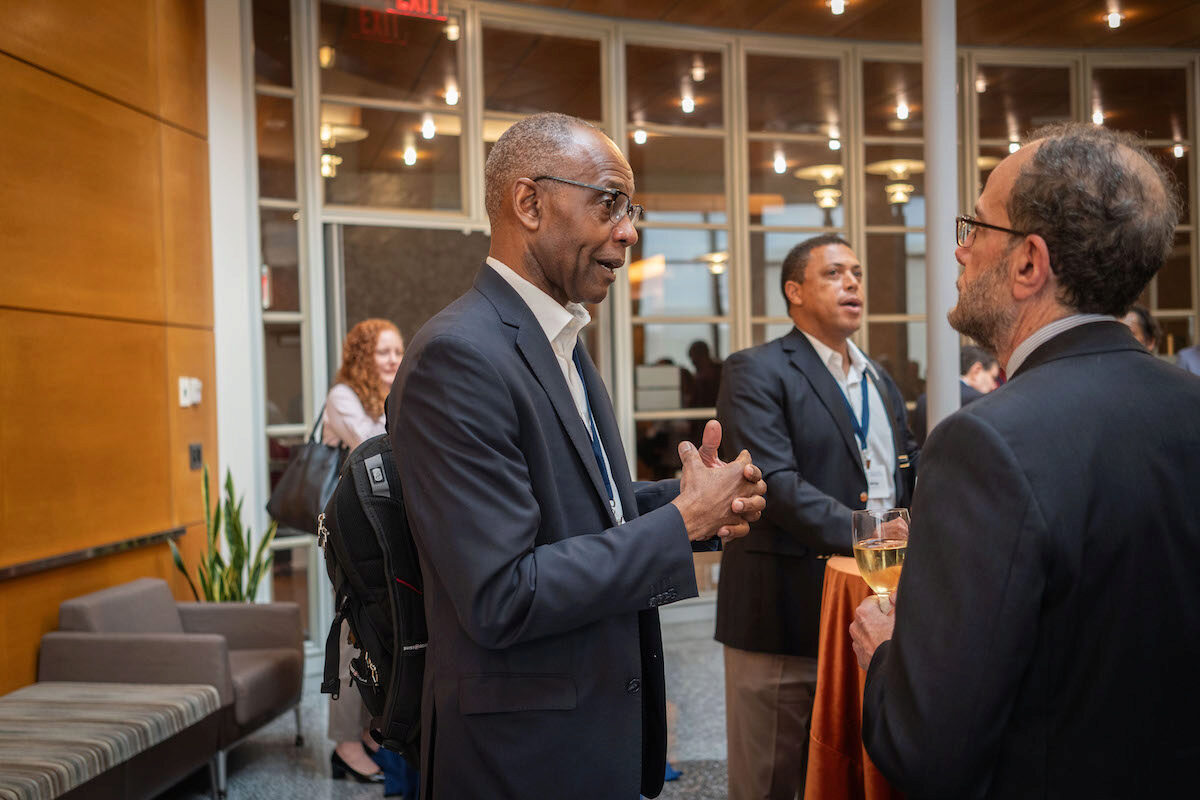 Ken Levy in conversation with a Frontiers in Quantitative Finance Conference attendee