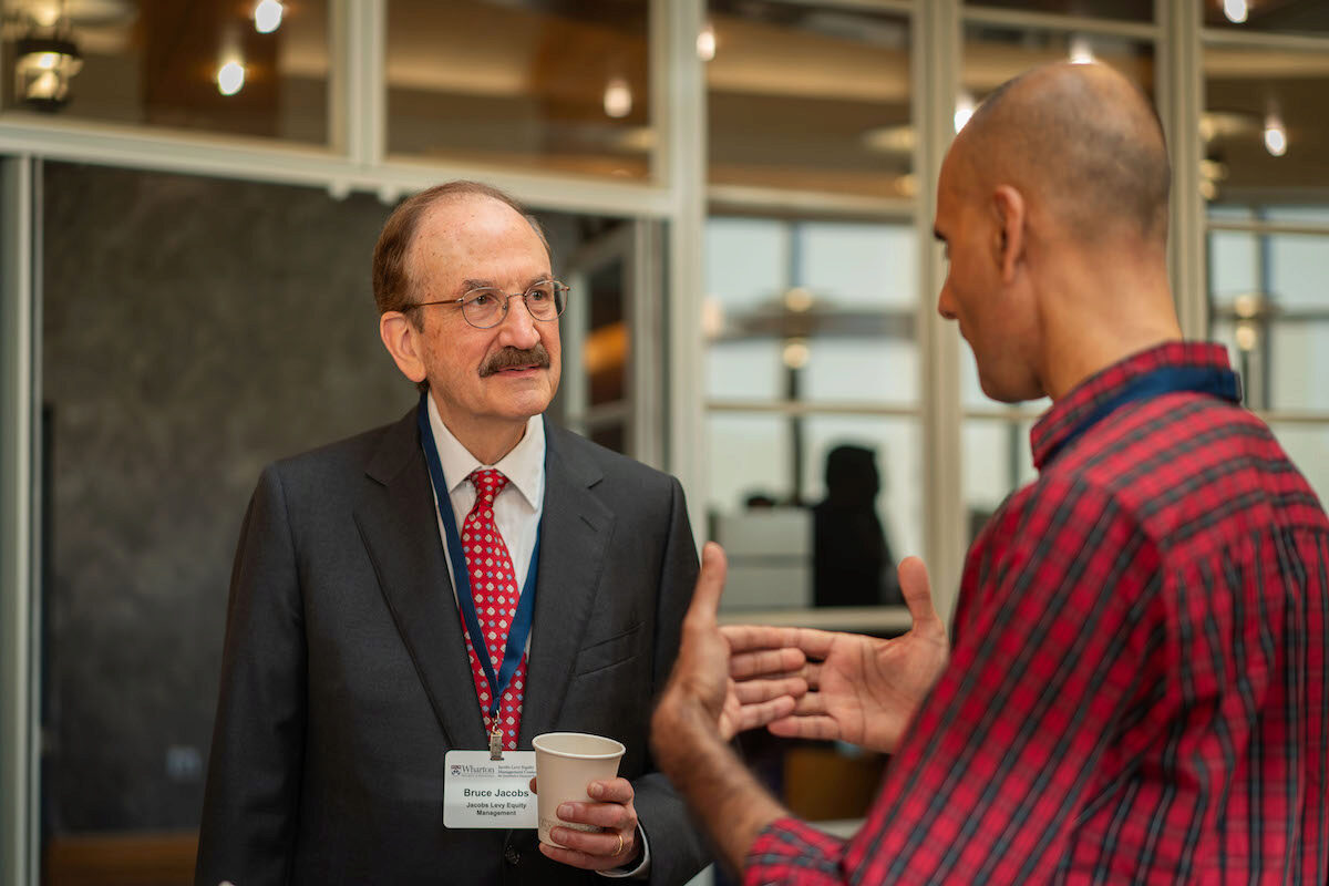 Bruce Jacobs and a conference attendee during the 2024 Frontiers in Quantitative Finance Conference