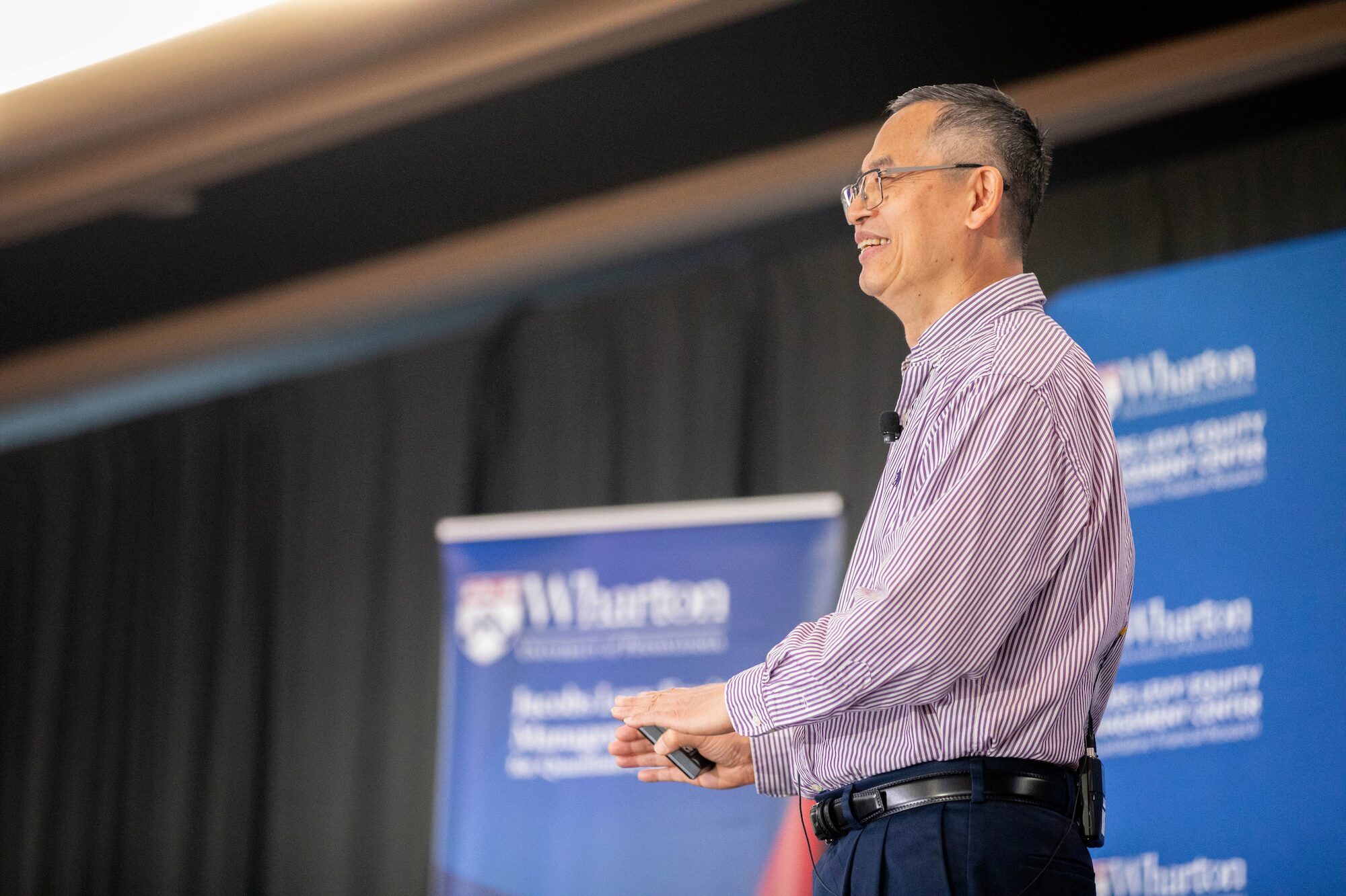 A conference speaker gives a presentation