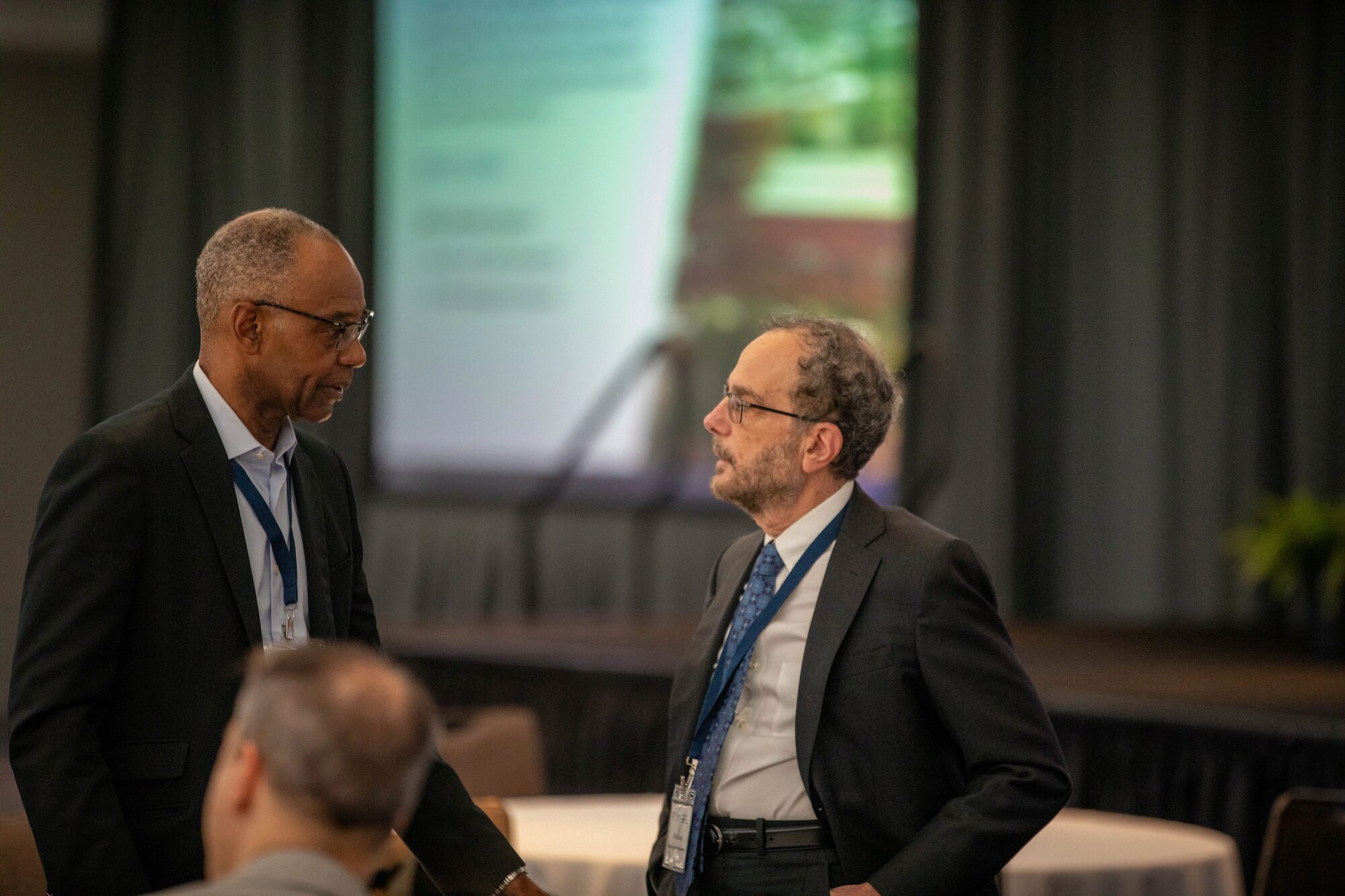 Two people in conversation at a conference